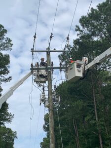Two workers Maintaining Auburn’s power lines. From left: James “Ruffin” Duncan and Scott Morgan
