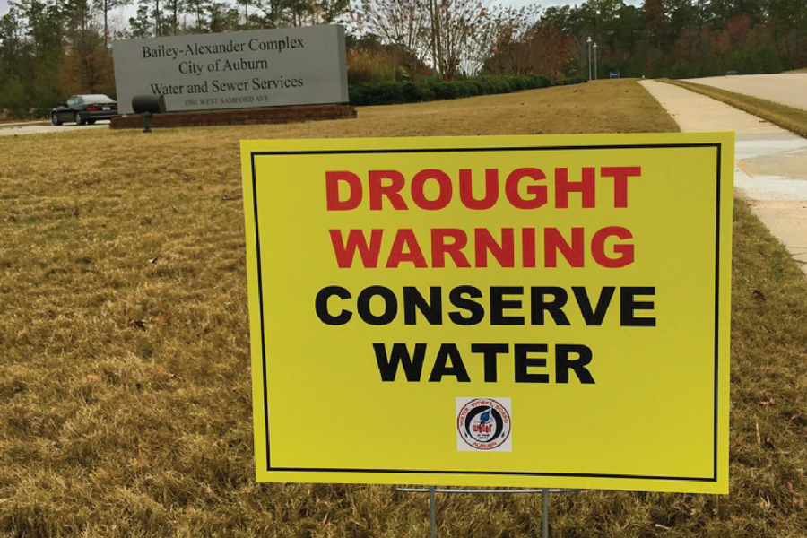 Sign that reads "Drought Warning conserve water"