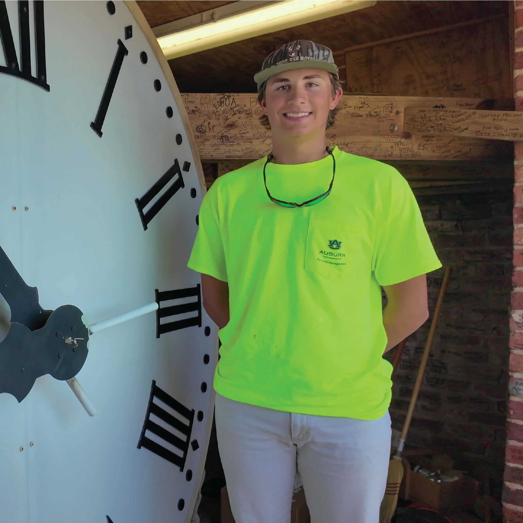 Garrett Griffin infront of Samford Clock Face.