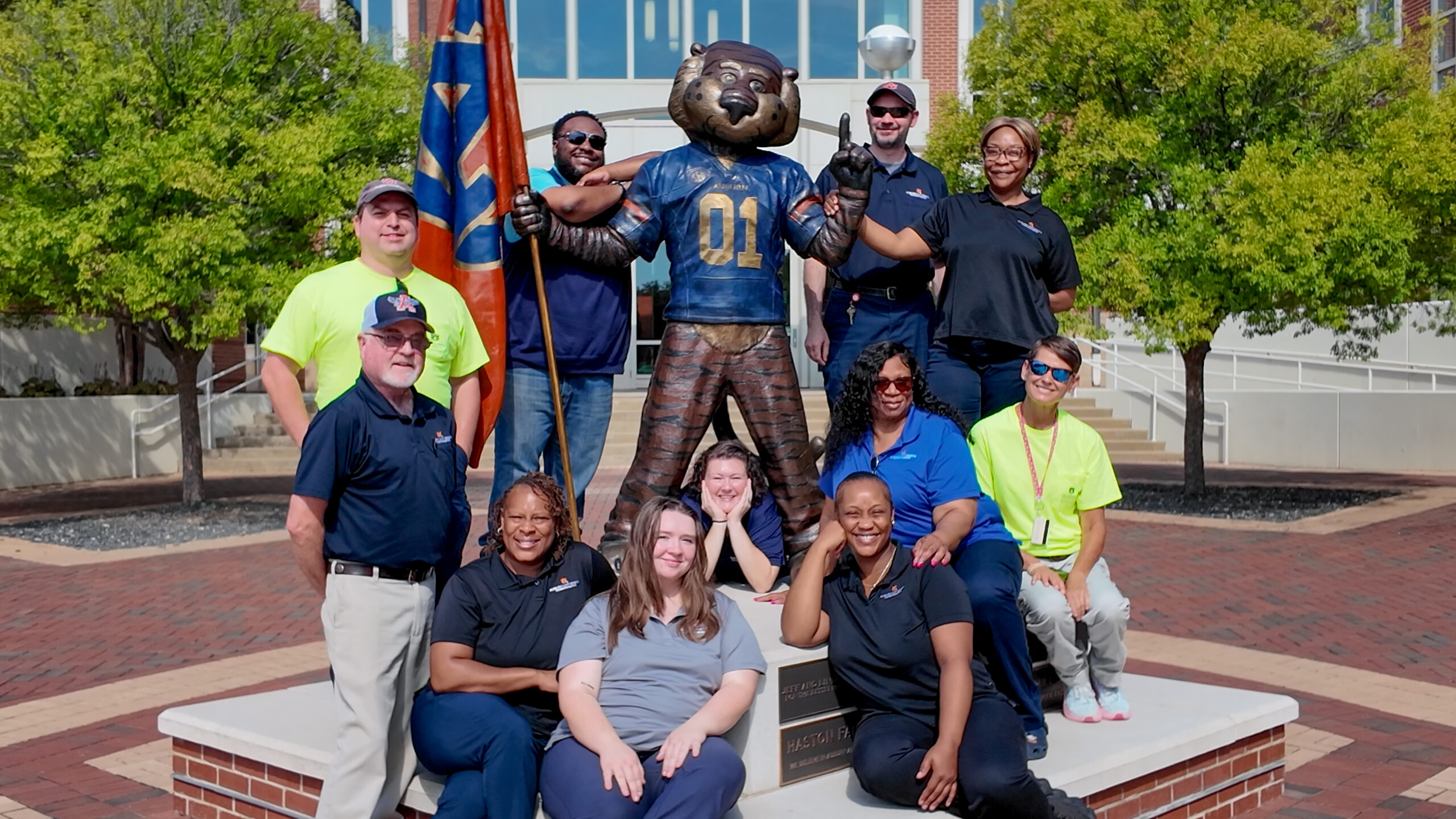 Auburn University Mail Services was recognized as the 2026 Mail Center of the Year by the National Association of College and University Mail Services. Shown front, from left, are Clarence Fox, Tonia Rosser, Jordan Sandlin, Sarah Berry, Jasmine Pressley, Reta Jackson and Denise Kalan, and, back, Bryce Oleson, Manager Anthony Driver, Assistant Manager John Raiford and Rovel Burney.