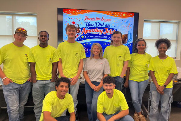 Apprentices pose for photo.