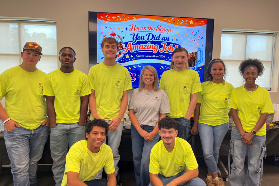Apprentices pose for photo.