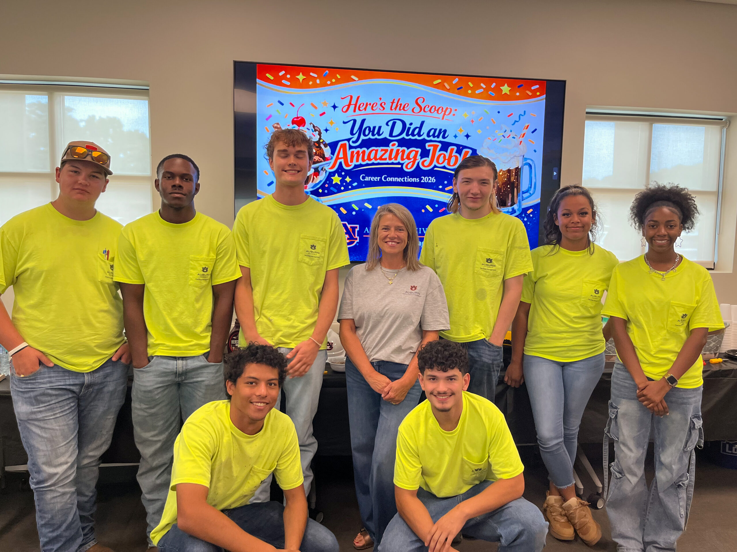 Apprentices pose for photo.