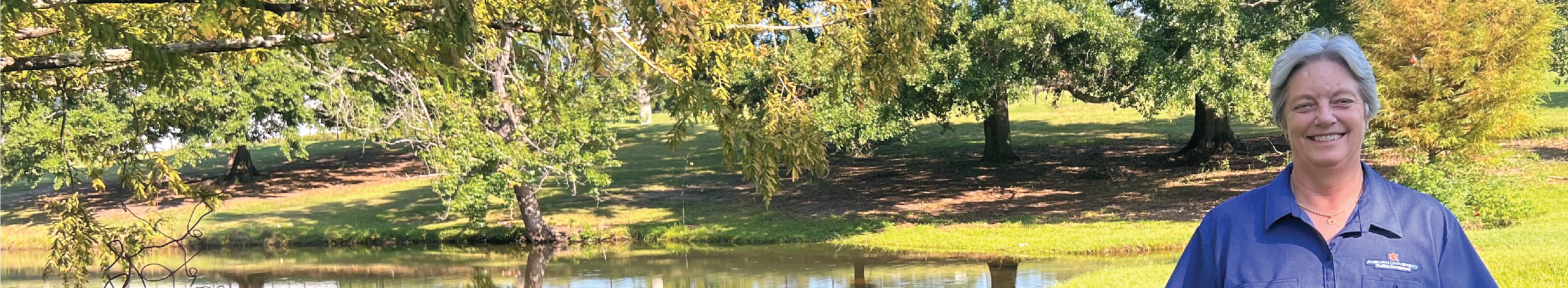 Margrit Tate infront of facilities Pond