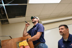 Cole Witt and Travis Talley inspect ceiling.