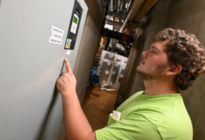 Connor Black inspects power.