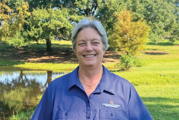 Margrit Tate infront of facilities Pond
